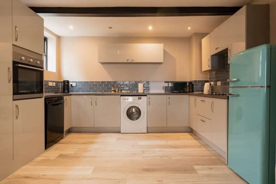 Home 2 - The Kitchen: whip up your favourite meal meals in the beautifully presented kitchen, equipped with modern amenities and ample storage space.
