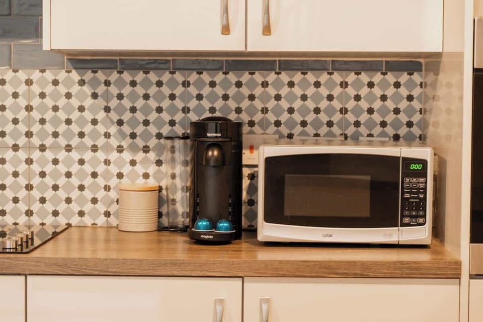 Home 1 - The Kitchen: treat yourself to a special coffee using our provided coffee machine.