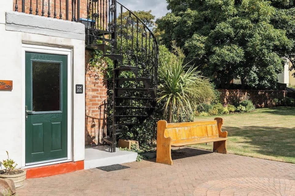 The Entrance: the property is found on the second floor, accessible through the spiral staircase. Please note that these steps are steep and not suitable for anyone with mobility issues.