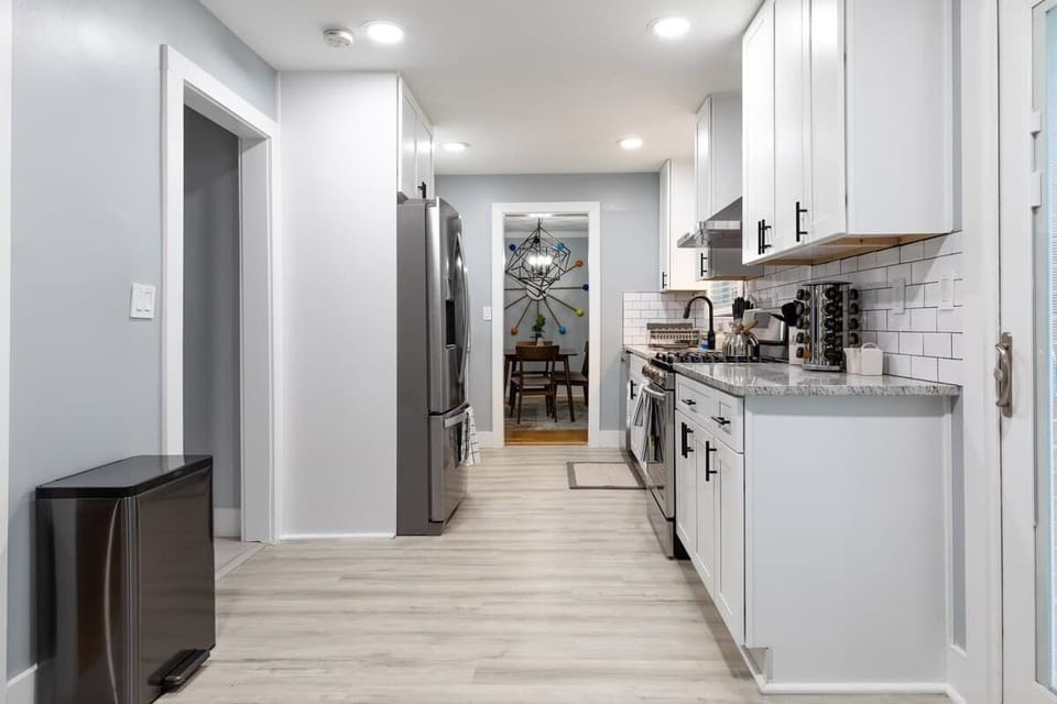 The clock, chandelier, kitchen transition is kinda nuts... fridge kinda thicc tho