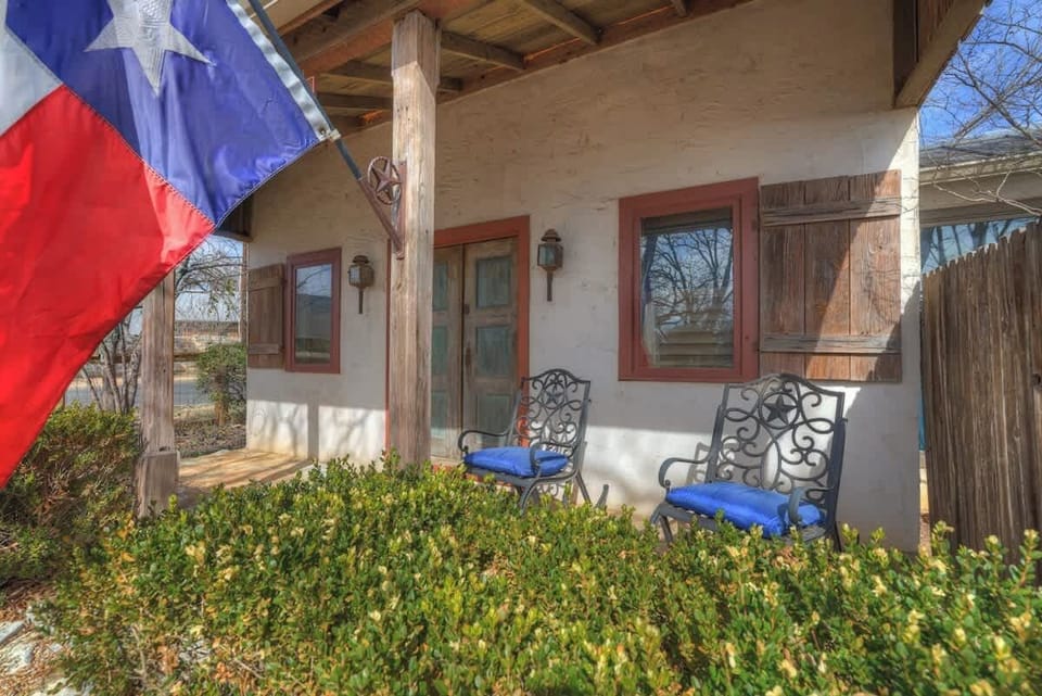Enjoy the front porch with seating for two.