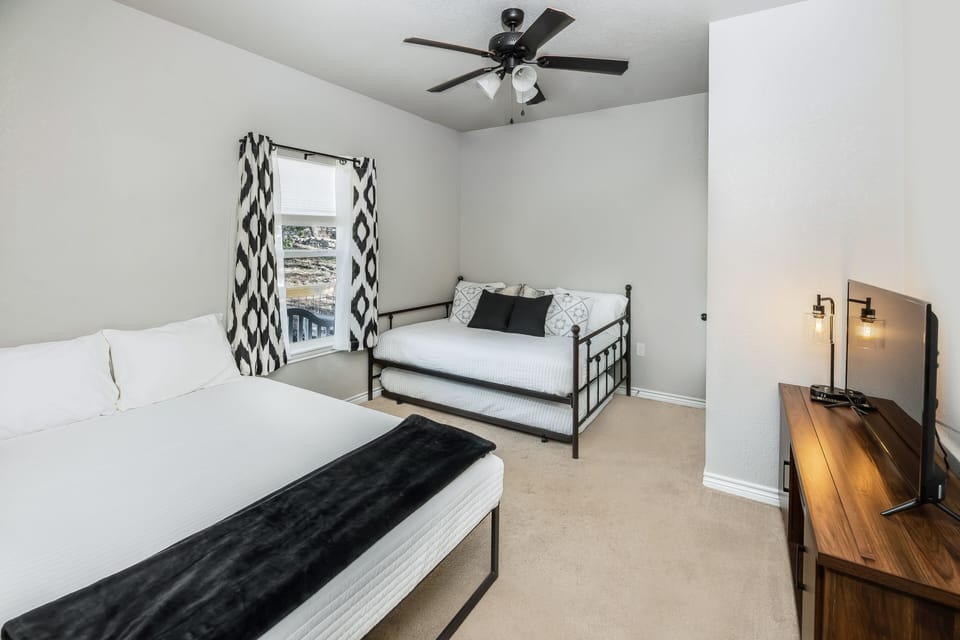 The third bedroom has a queen bed, full bed, and a trundle twin bed underneath. 