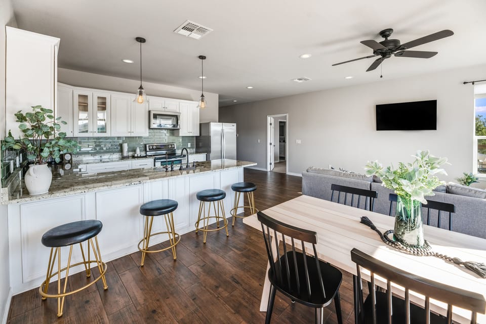 Spacious dining table and bar seating for the whole group