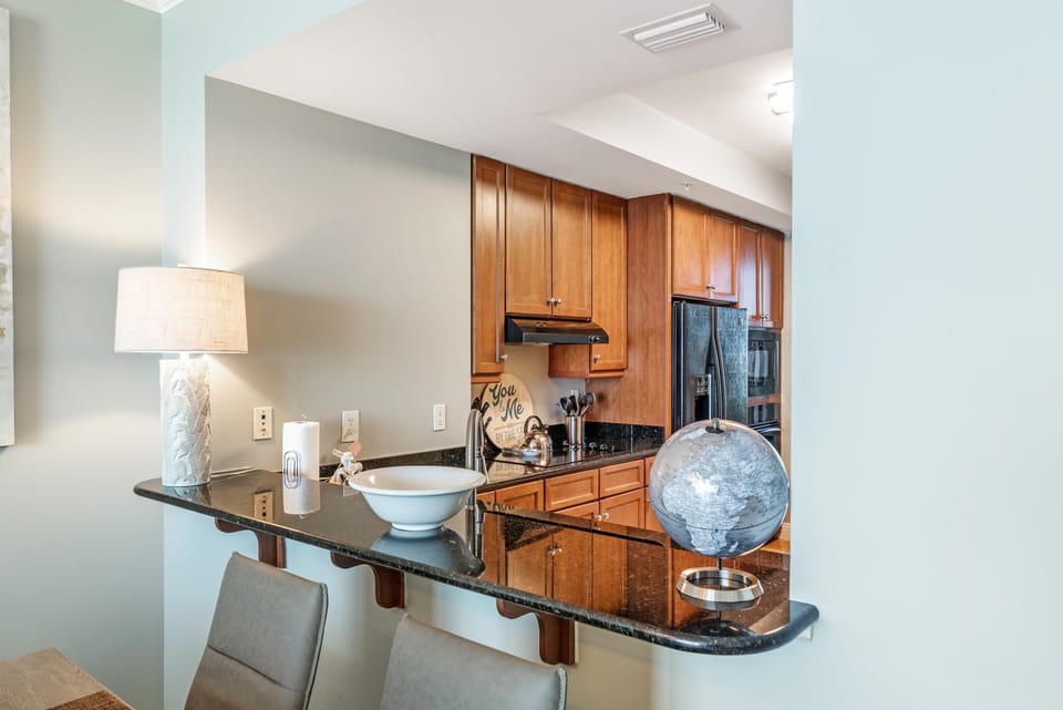 Condo, Multiple Beds (Indigo East 904) | Private kitchen | Oven, toaster, paper towels