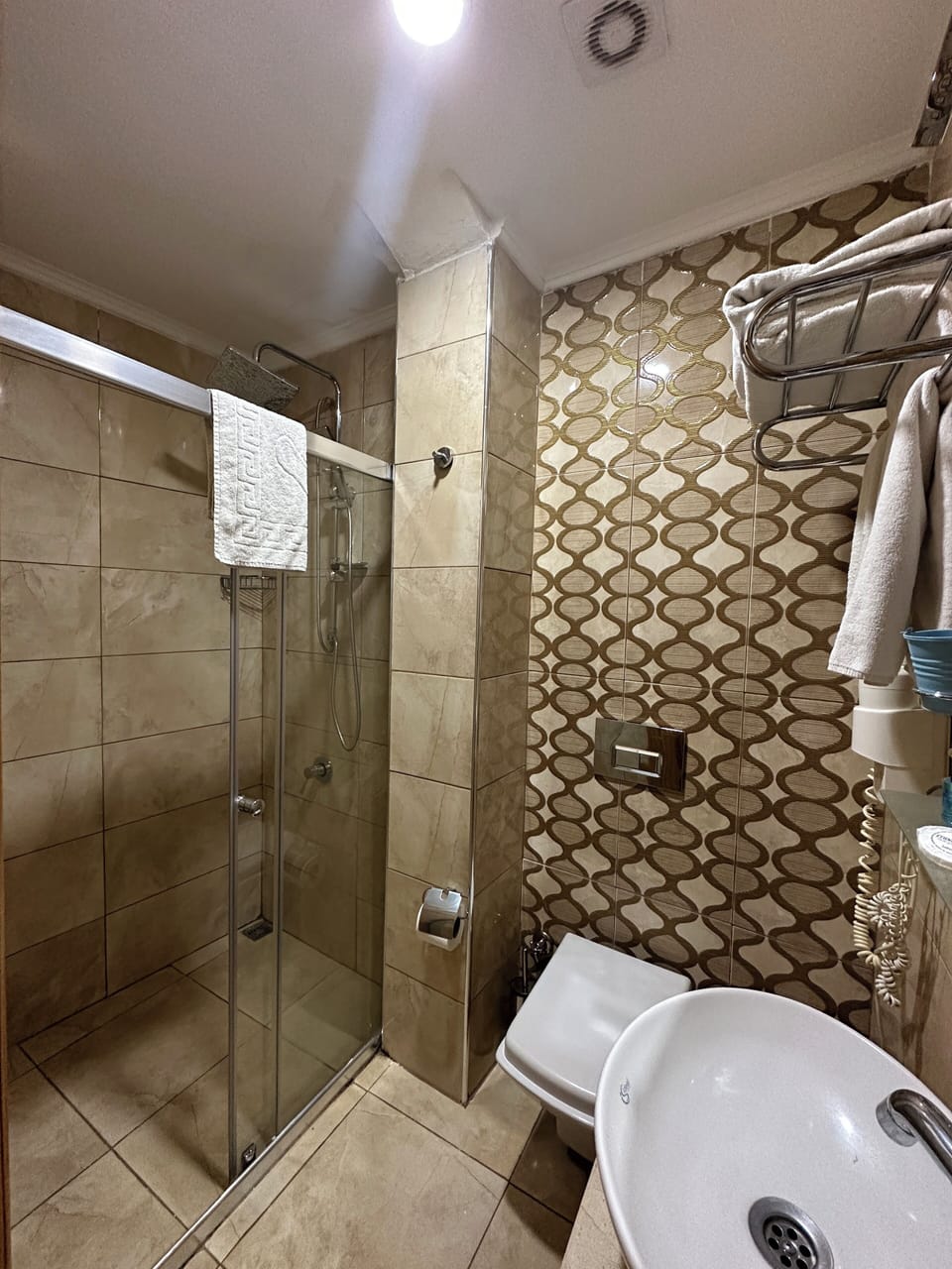 Shower, free toiletries, hair dryer, slippers