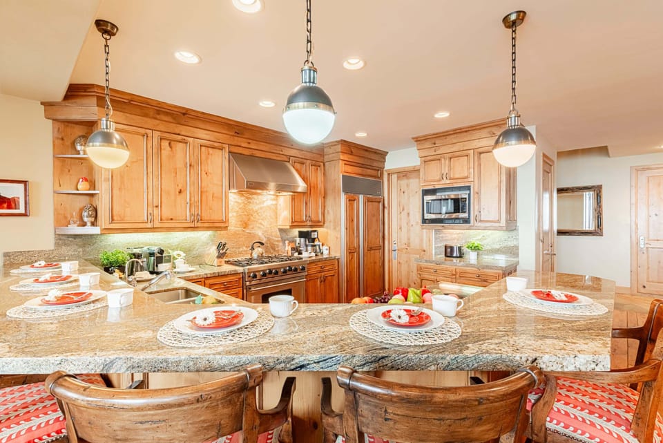Stunning granite counters with bar seating for six