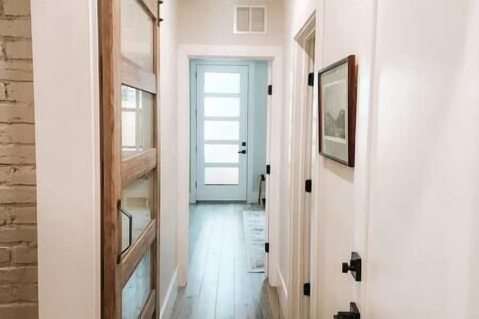 Private Hallway with Sliding Door to Kitchenette