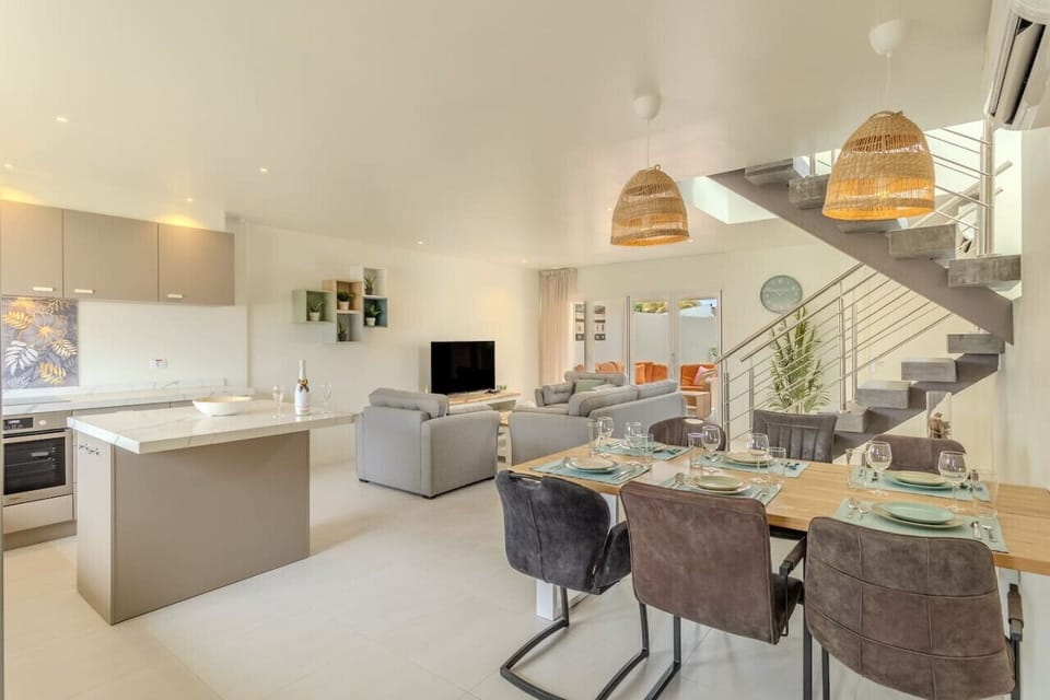 Savor moments of togetherness in Villa Twin A`s elegant dining area. With stylish furnishings and ample space for gatherings, every meal becomes a celebration of camaraderie and comfort