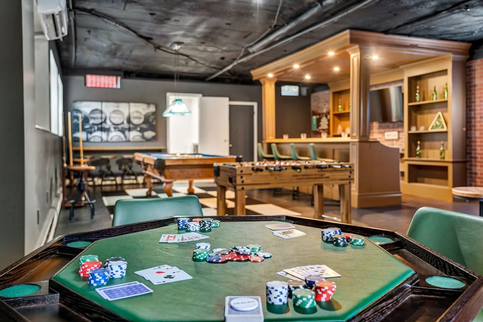 Custom bar and game room with arcade games, pool table, 60-inch, poker, etc.