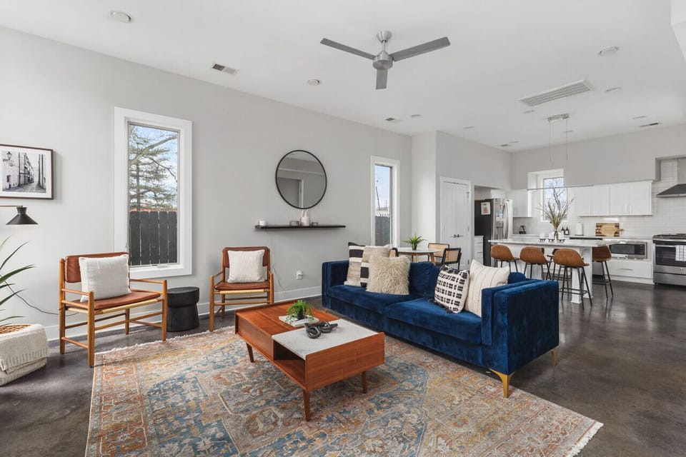 Spacious yet cozy living room with lots of natural light, a Smart TV, and plenty of seating.