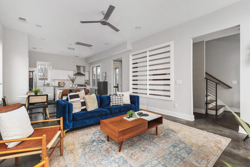 Spacious yet cozy living room with lots of natural light, a Smart TV, and plenty of seating.