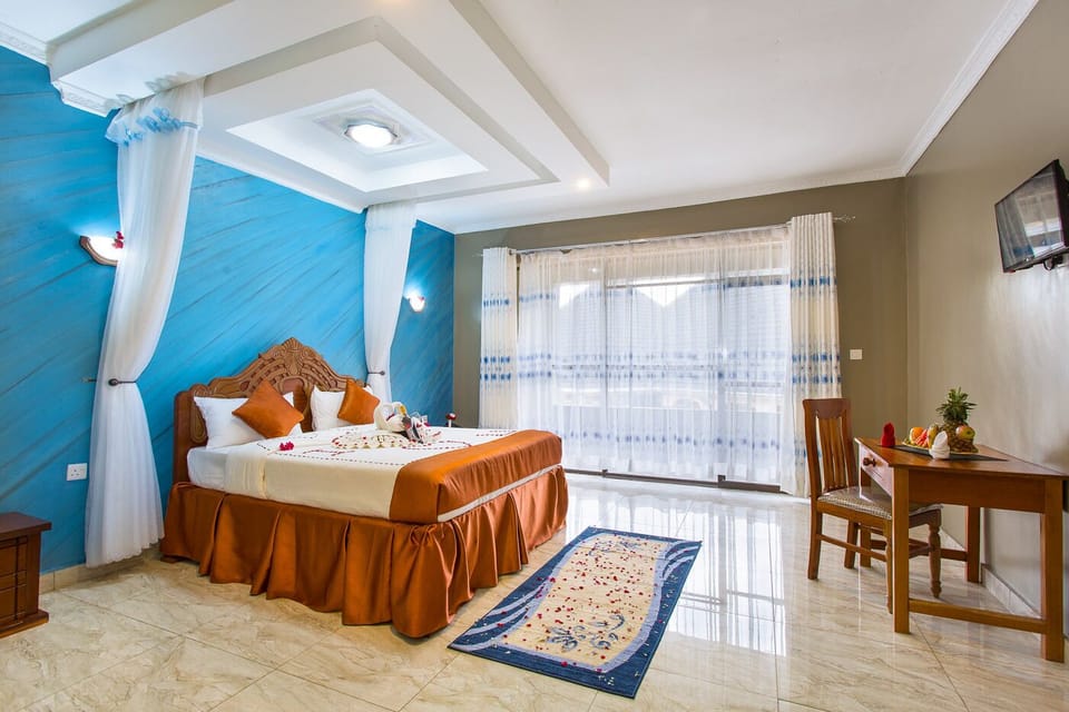 Deluxe Double Room | Living area | 48-inch Smart TV with digital channels