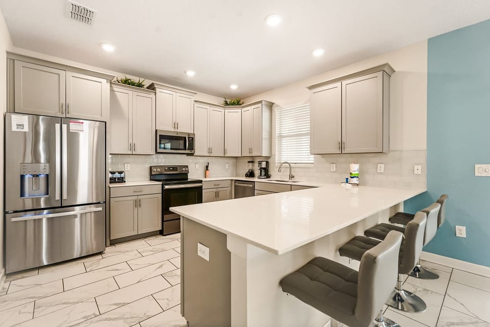 Sleek and modern kitchen with a spacious island, perfect for cooking and entertaining.