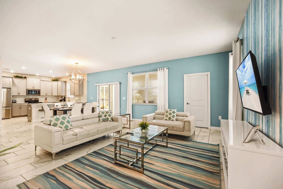 Experience luxury in this spacious living area with modern amenities and stylish decor, perfect for relaxation and entertainment.
