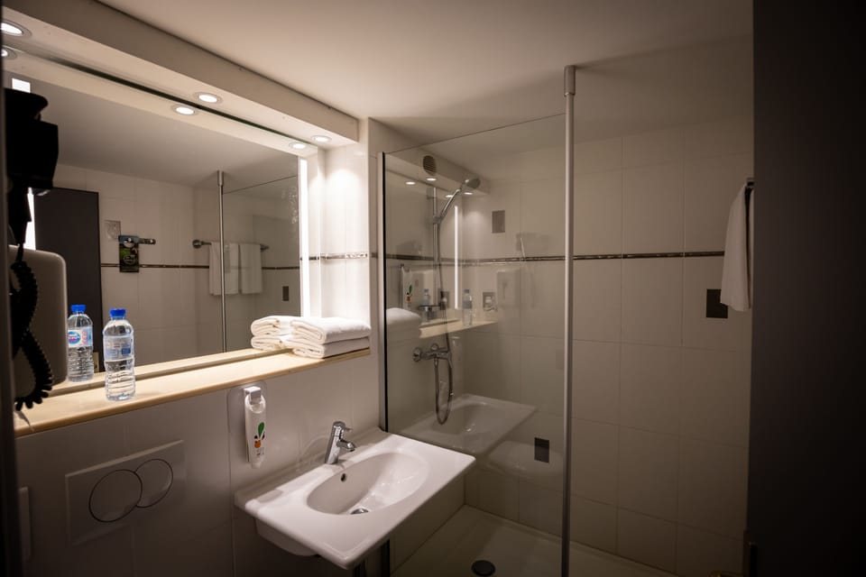 Shower, eco-friendly toiletries, hair dryer, towels