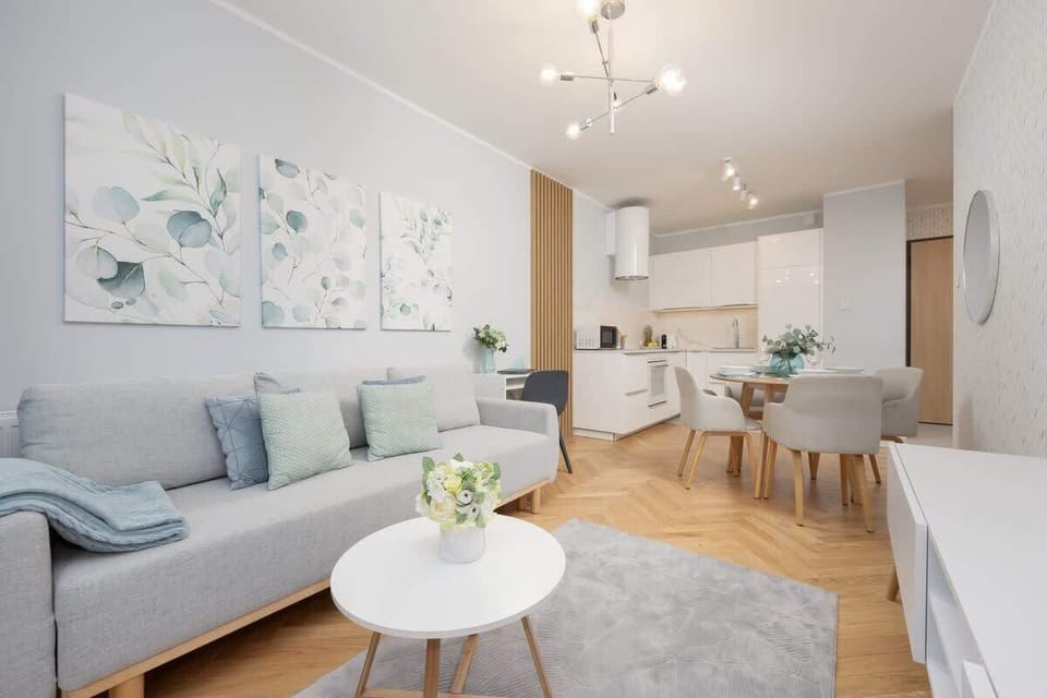 Living room with fully equipped kitchenette and dining area