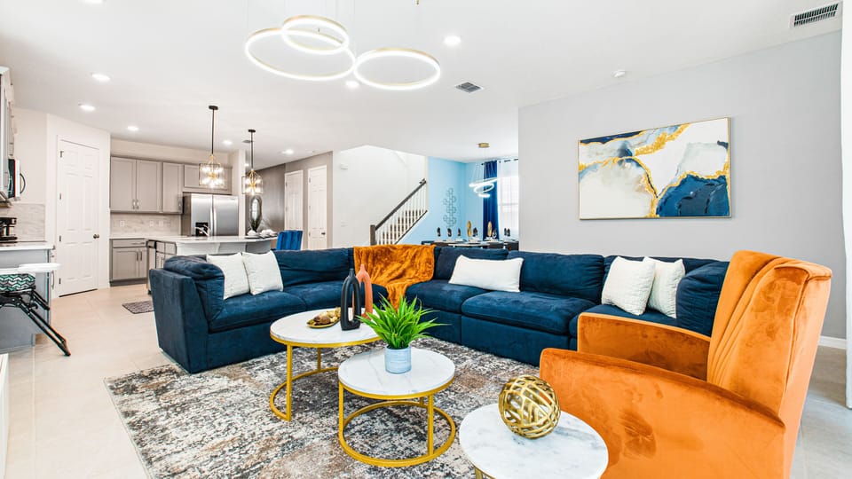 Spacious Living Area with Comfortable Sofa and Flat Screen TV