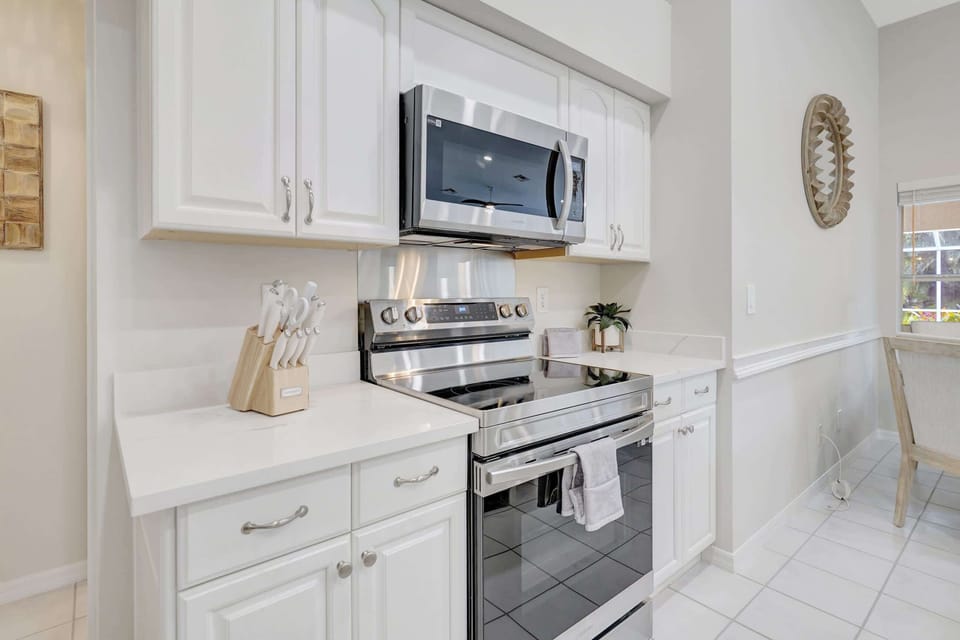 The stainless steel appliances compliment the finishes in the kitchen
