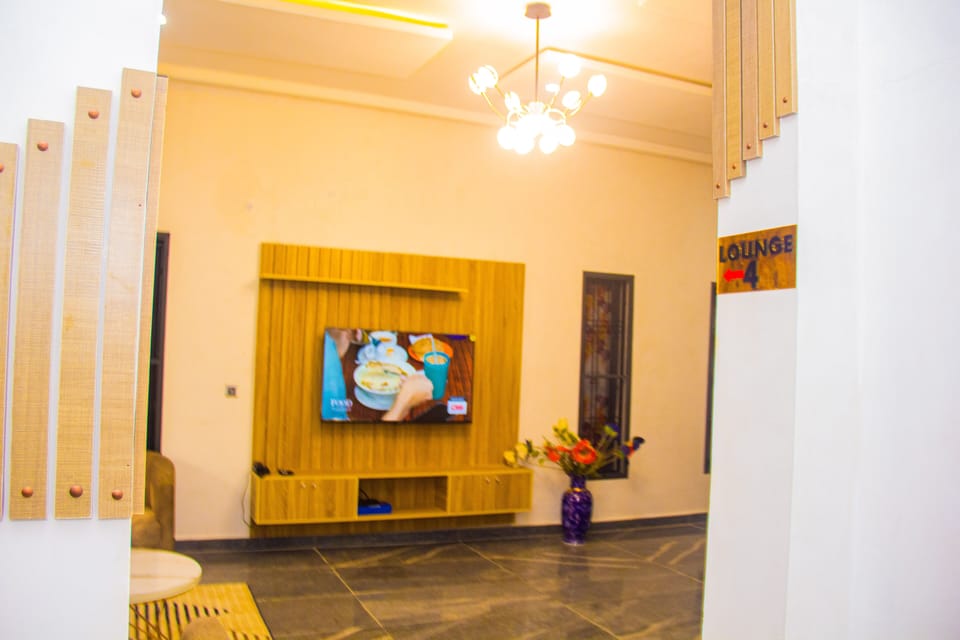 Executive Studio Suite | Living area | 45-inch plasma TV with cable channels