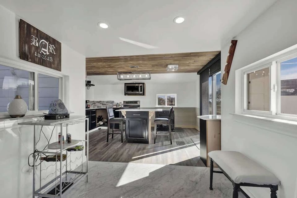 Flows seamlessly into the kitchen and dining area.