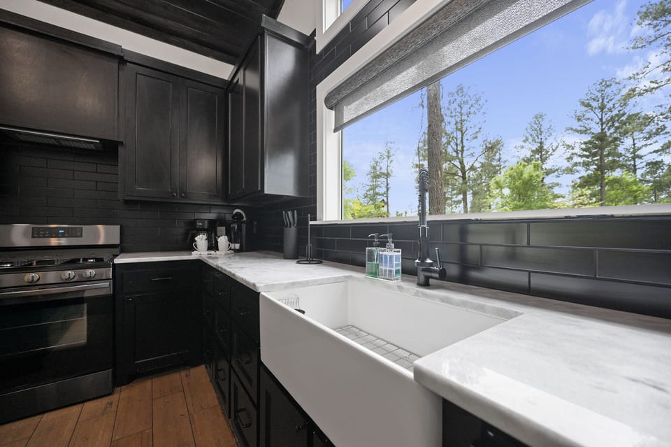 This large farmhouse sink has plenty of room for washing dishes...or to keep stacking them and just do them later...