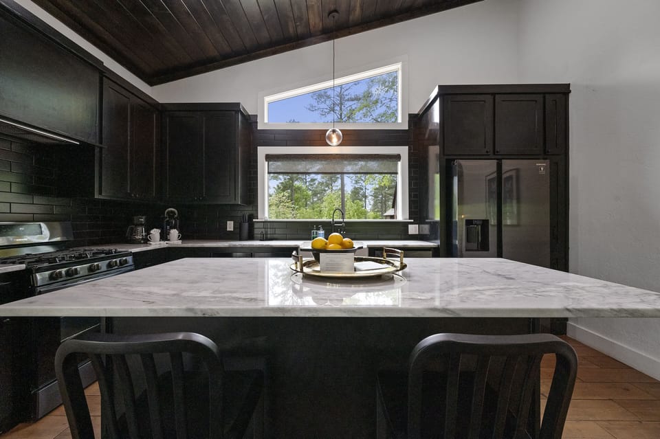 You'll love this huge kitchen island that gives plenty of prep space and doubles as additional dining seating.