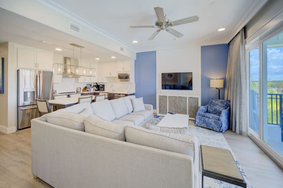 A sunlit lounge with soft, inviting furnishings that open up to sweeping views.