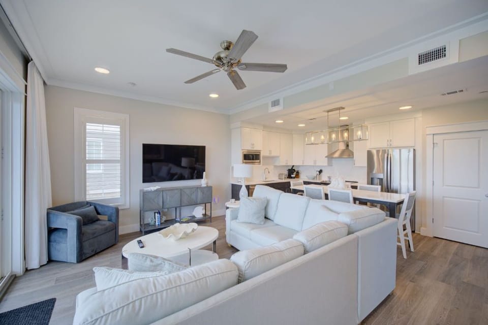 An open-plan living space with chic décor and plush furnishings, offering a seamless blend of style and comfort.