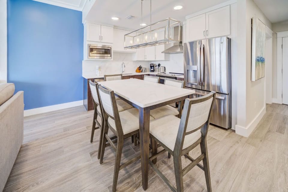 A modern dining setup that complements the open-plan layout for a seamless living experience.