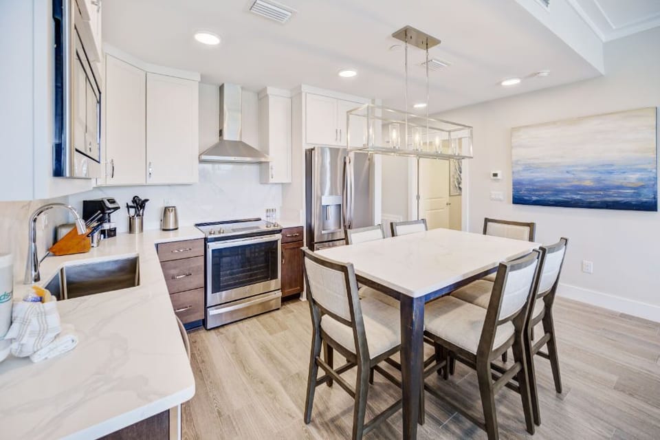 A stylish dining area adjacent to the kitchen, perfect for both intimate dinners and entertaining guests.