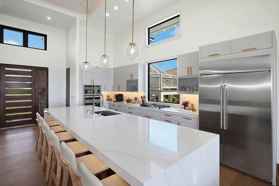 Chef's kitchen X-large island plus additional large fridge around the corner.