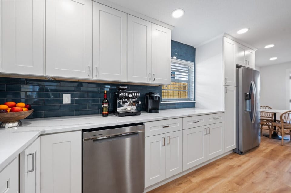 Open kitchen with chef cookware and new appliances
