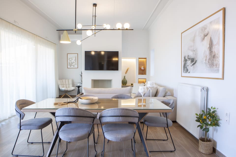 Open plan living and dining area with 55' smart TV