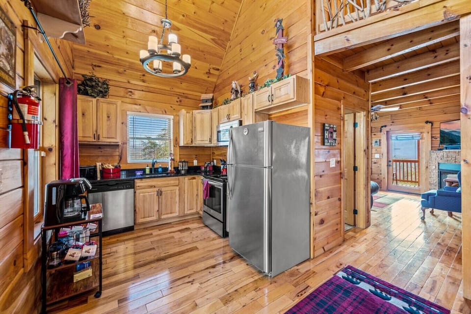 As you enter the cabin, the kitchen is just inside the front door.