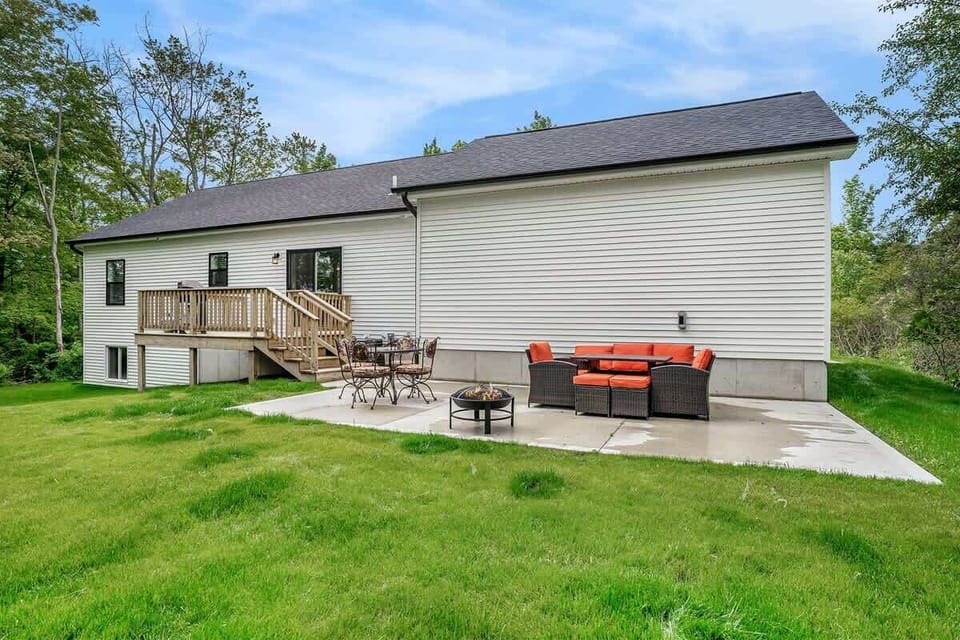 Embrace Summer Play with a Spacious Backyard Perfect for Pups and the Kiddos