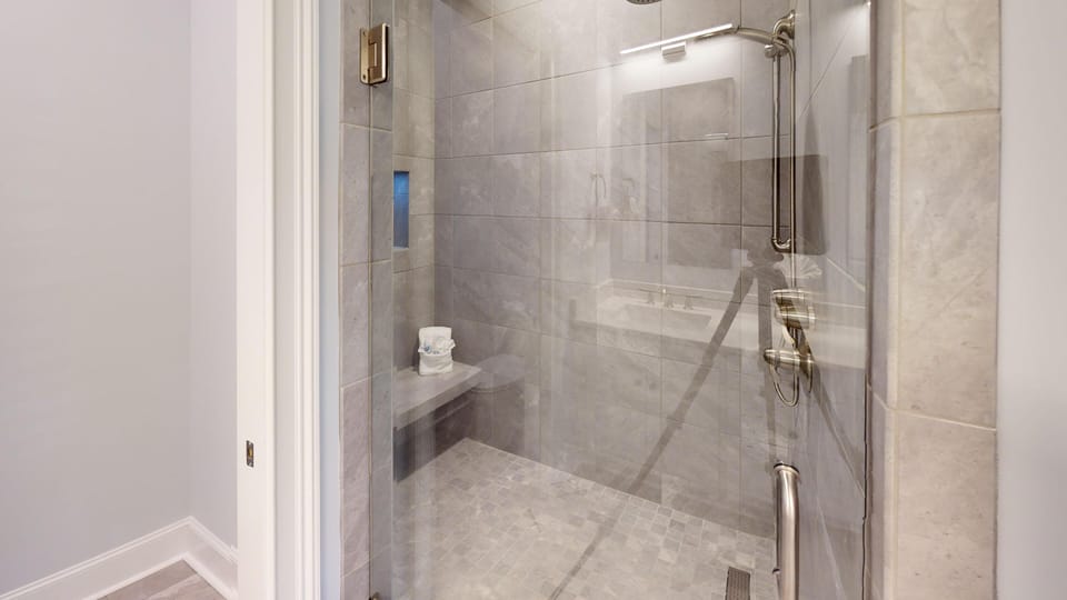 Clean and updated bathroom with modern fixtures and a fresh, comfortable setup for guests.