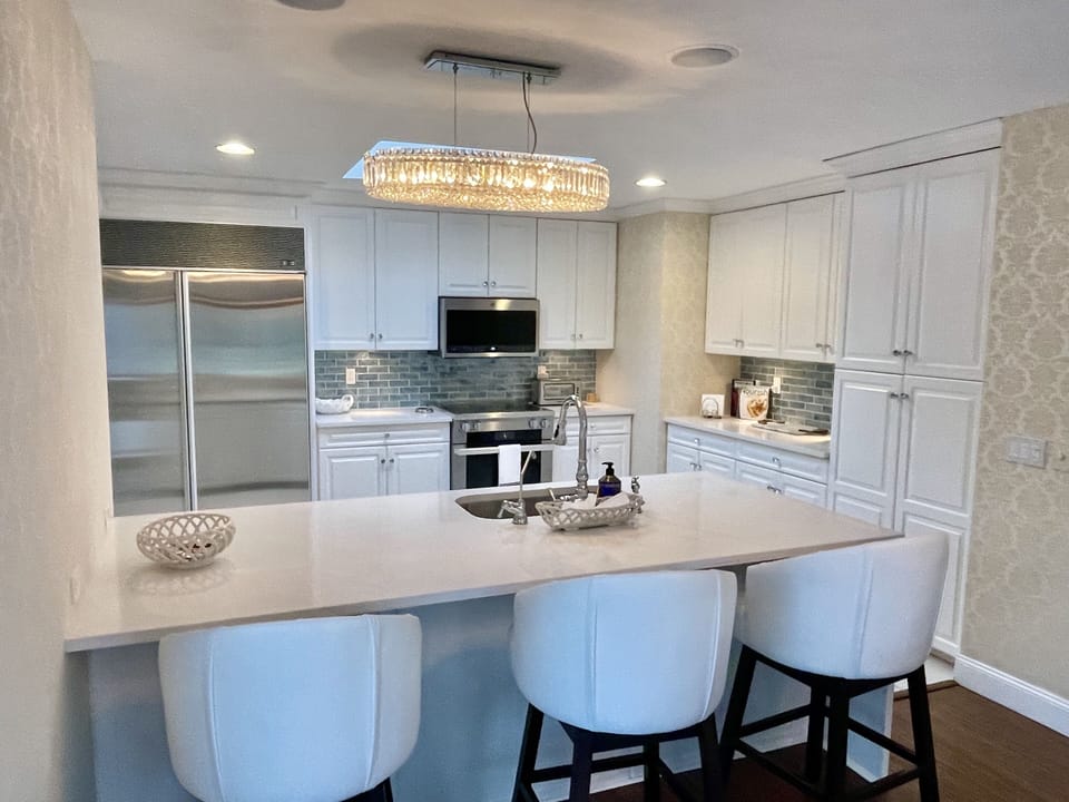 new kitchen with bar stool seating