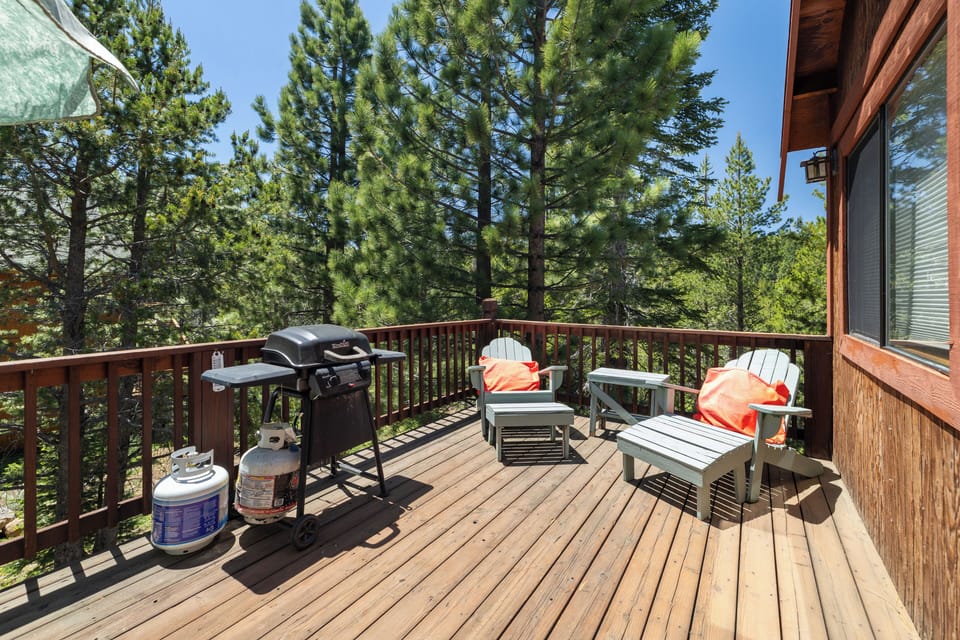Sunny deck with lounge seating and a gas BBQ