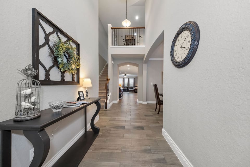 Enter through the spacious foyer, with 3 bedrooms on main level & 1 upstairs.