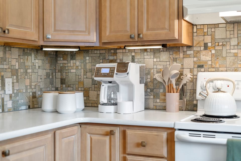 The coffee station comes with K-cups, ground coffee, teas, sugar/stevia, creamer