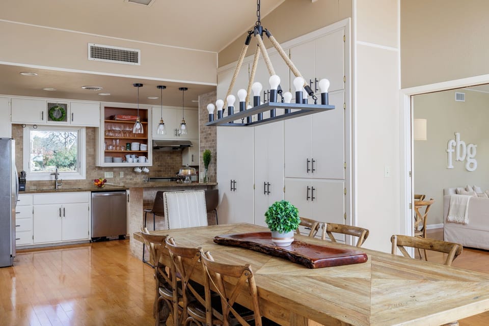 Enjoy memorable dining experiences in the welcoming ambiance of the dining area, featuring a beautiful wood table, stylish chairs, and plenty of natural light.