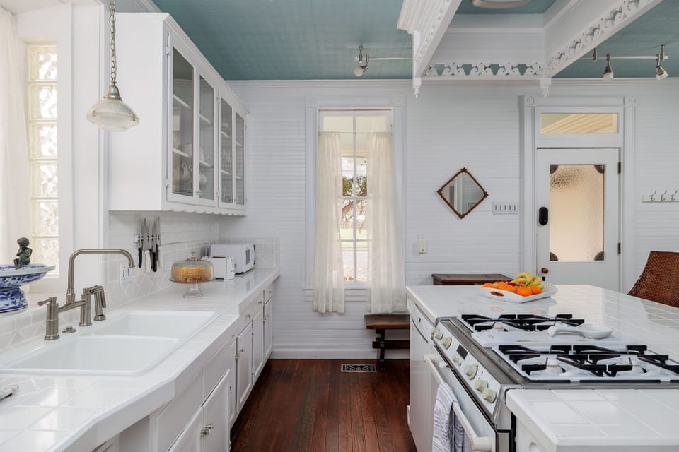 Experience the joy of cooking in our spacious kitchen, complete with a convenient island, stainless steel appliances, and all the tools you need to whip up delicious meals