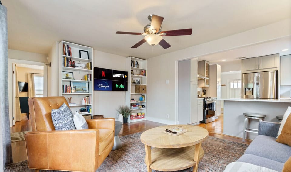 Spacious living room with sleeper sofa, smart tv, and games!