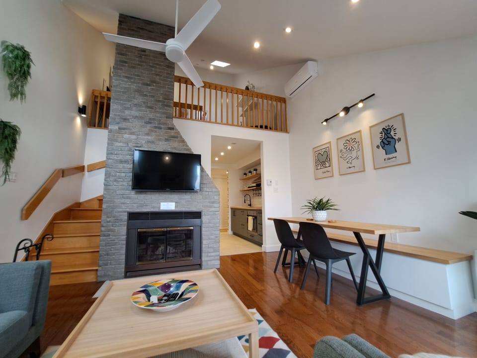 Living room area. Dinning area, TV and fireplace.