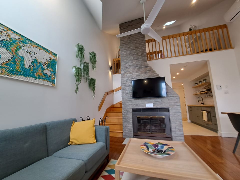 Living room area. Fire place and TV.