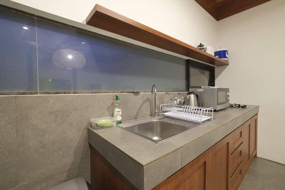 Deluxe Villa | Private kitchen | Fridge, stovetop, dishwasher, electric kettle
