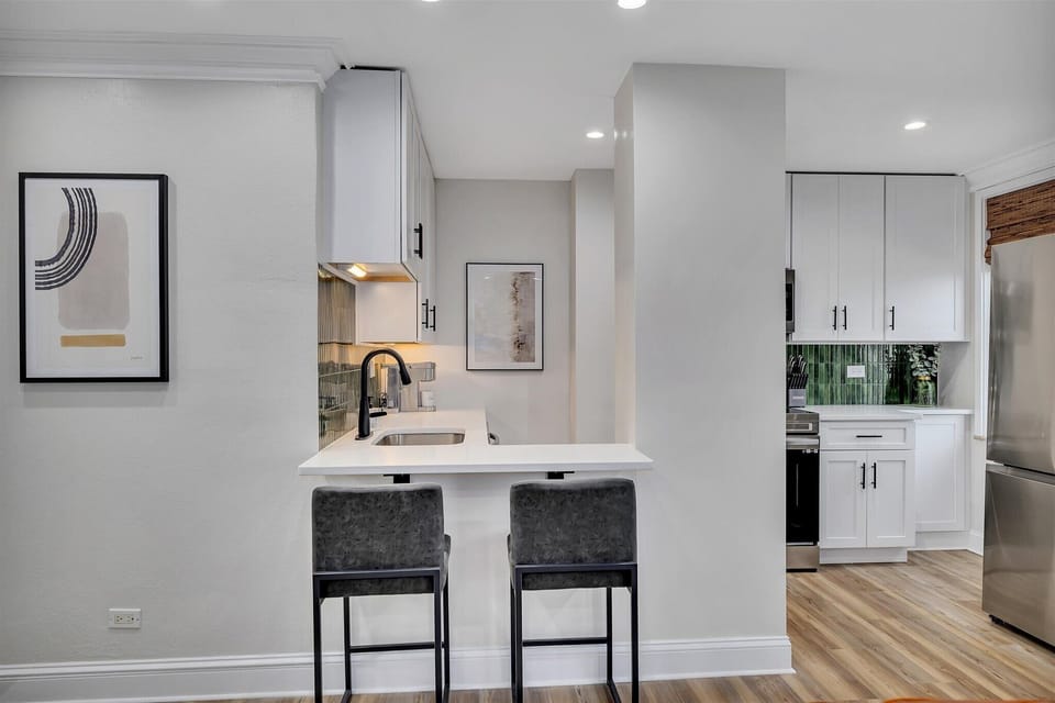 Breakfast bar w/ seating for two, perfect for quick meals or coffee