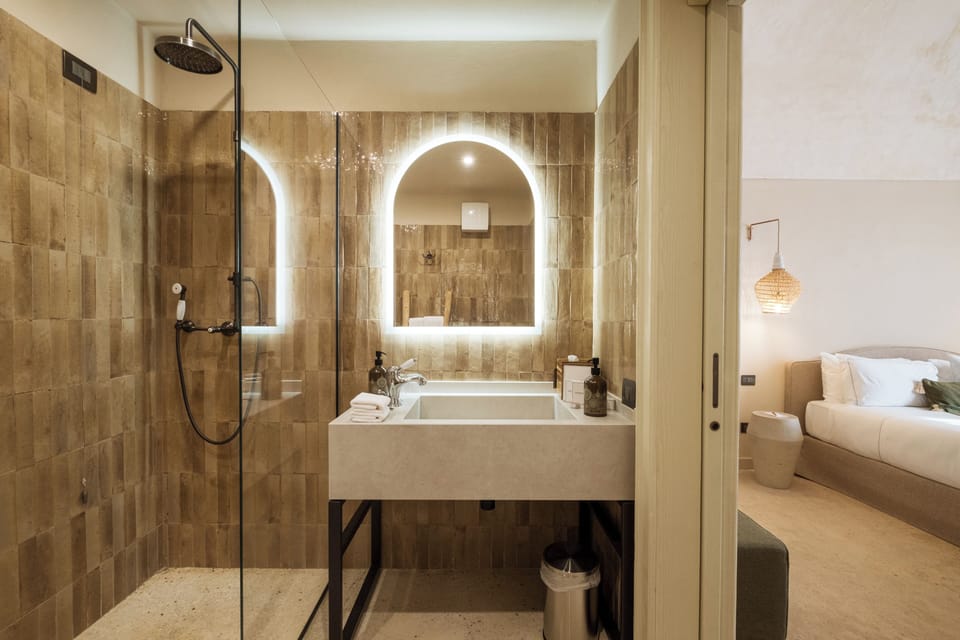 Superior Room | Bathroom | Shower, rainfall showerhead, designer toiletries, hair dryer