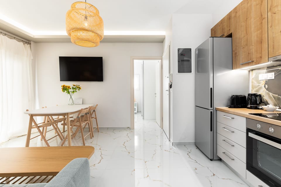City Apartment | Living area | 40-inch Smart TV with cable channels