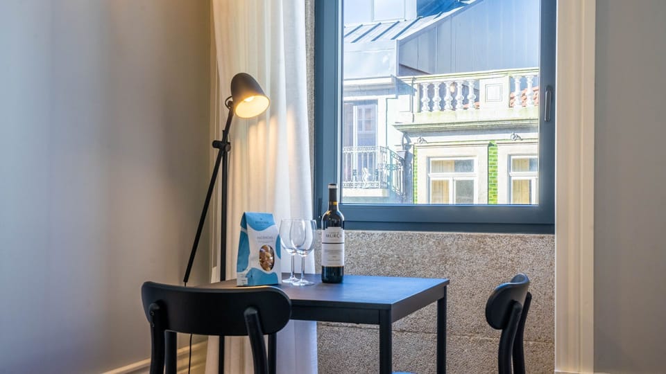 Share intimate moments and delightful flavors in our dining area for two, perfectly set by a sunlit window with charming city views. This cozy nook provides the ideal backdrop for enjoying a bottle of local wine or a leisurely breakfast.